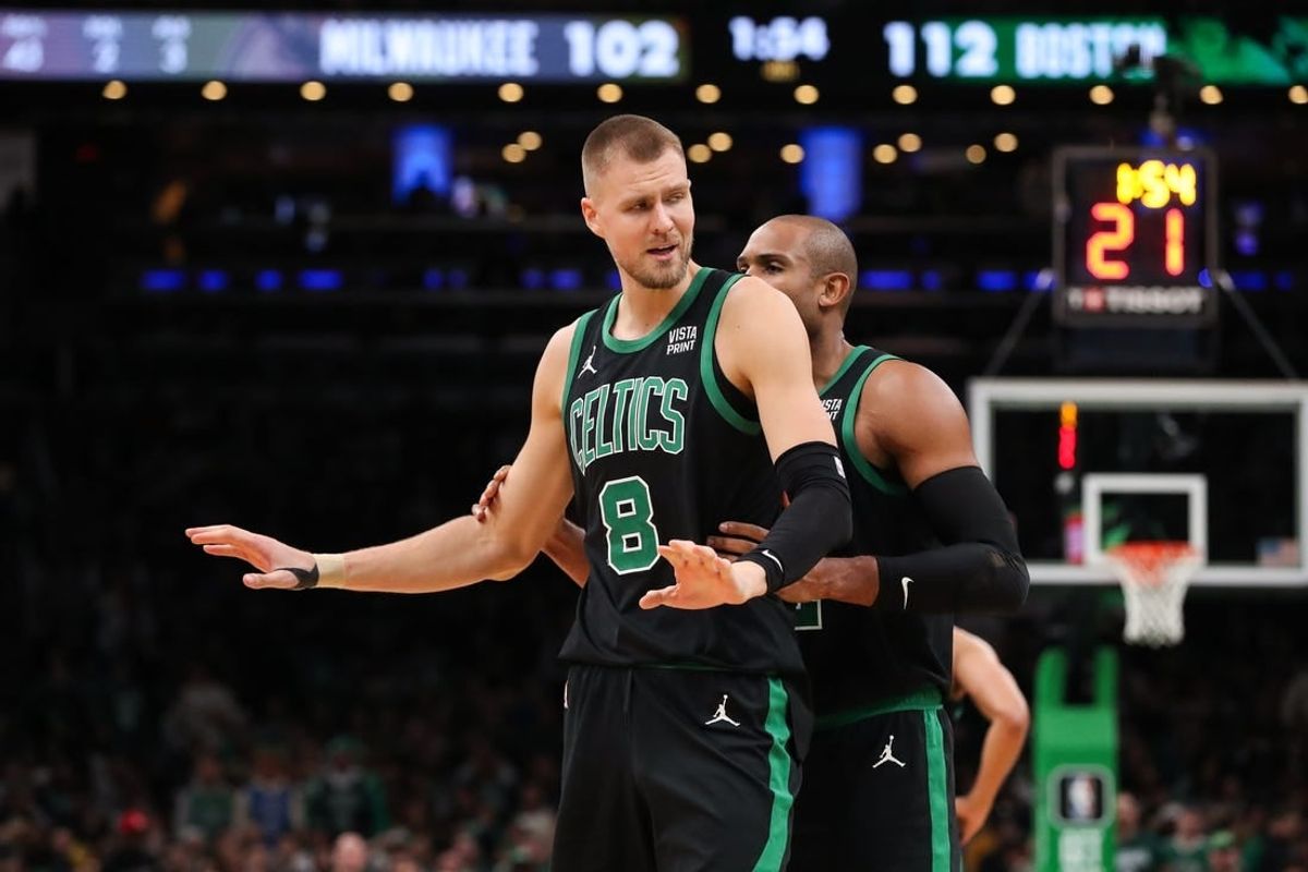 Nov 22, 2023; Boston, Massachusetts, USA; Boston Celtics center Kristaps Porzingis (8) reacts after getting a technical foul during the second half against the Milwaukee Bucks at TD Garden.
