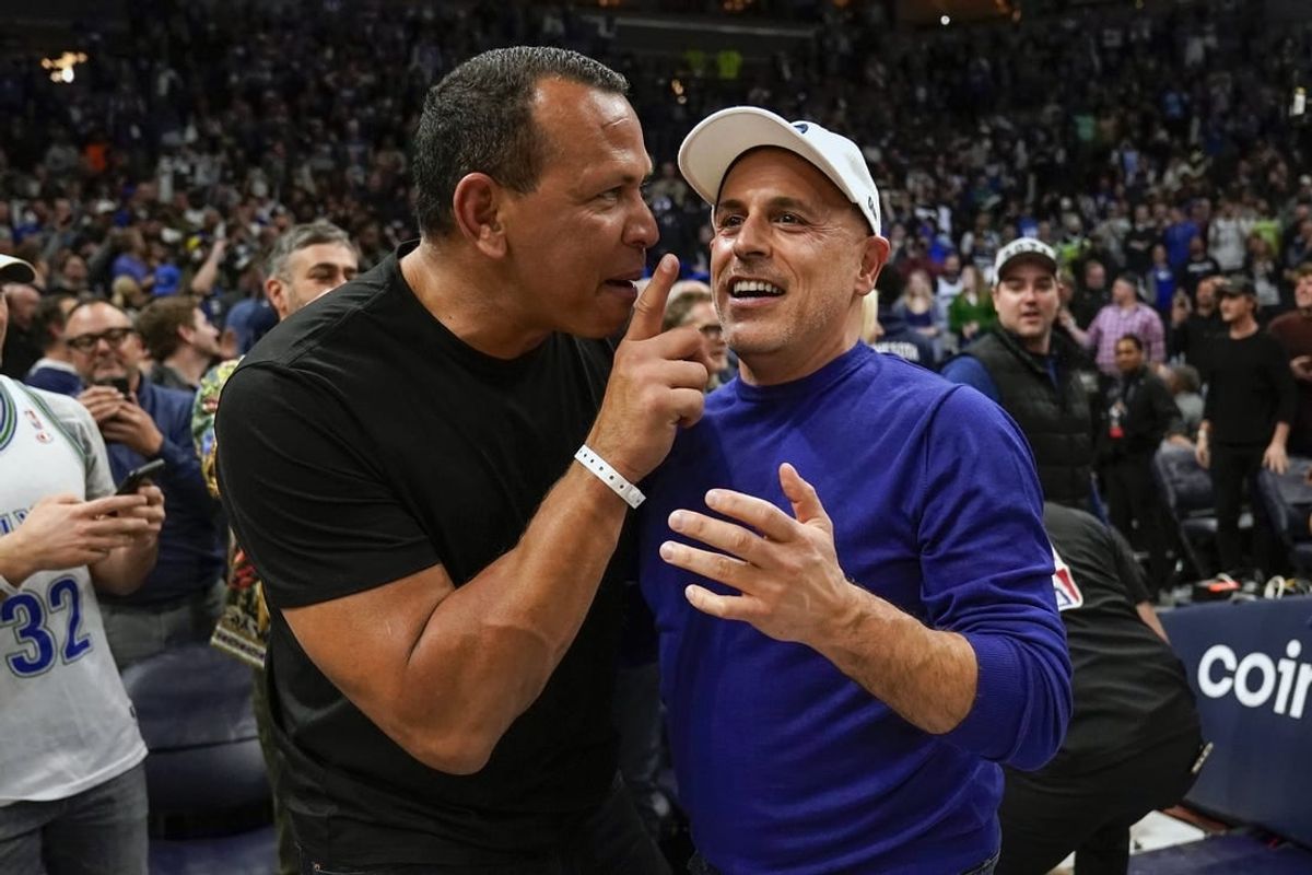 Apr 12, 2022; Minneapolis, Minnesota, USA;  Minnesota Timberwolves co-minority owners Alex Rodriguez and Marc Lore celebrate a victory over the Los Angeles Clippers after a play-in game at Target Center.