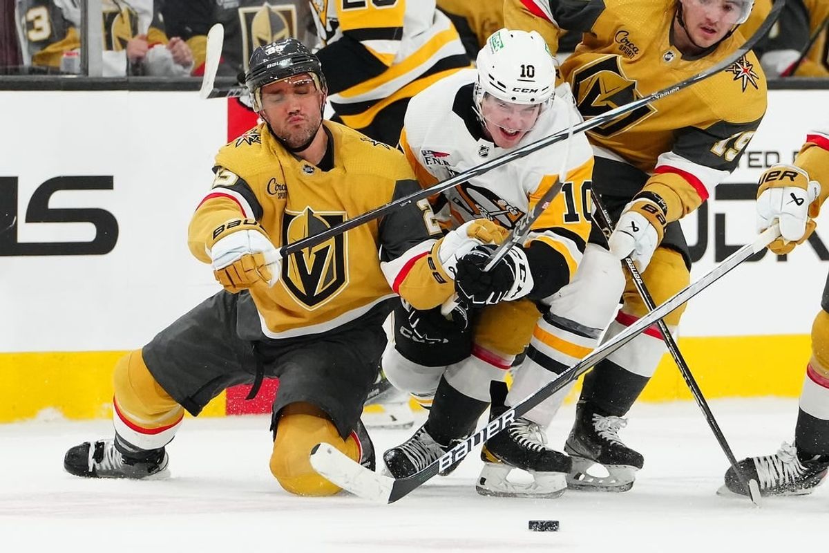 Jan 20, 2024; Las Vegas, Nevada, USA; Vegas Golden Knights defenseman Alec Martinez (23) keeps Pittsburgh Penguins left wing Drew O'Connor (10) from the puck during the second period at T-Mobile Arena.