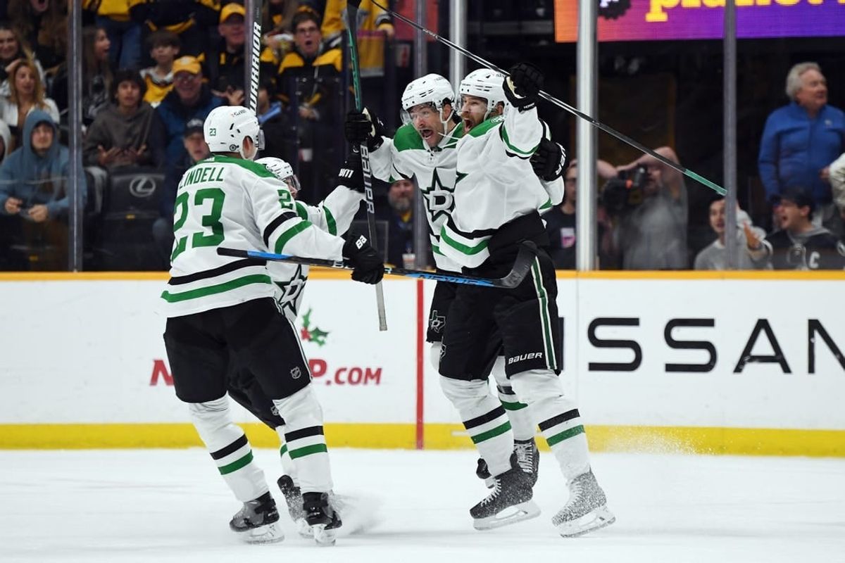 Dec 23, 2023; Nashville, Tennessee, USA; Dallas Stars defenseman Jani Hakanpaa (2) and center Craig Smith (15) celebrate with teammates after scoring the game-winning goal late in the third period to beat the Nashville Predators at Bridgestone Arena.