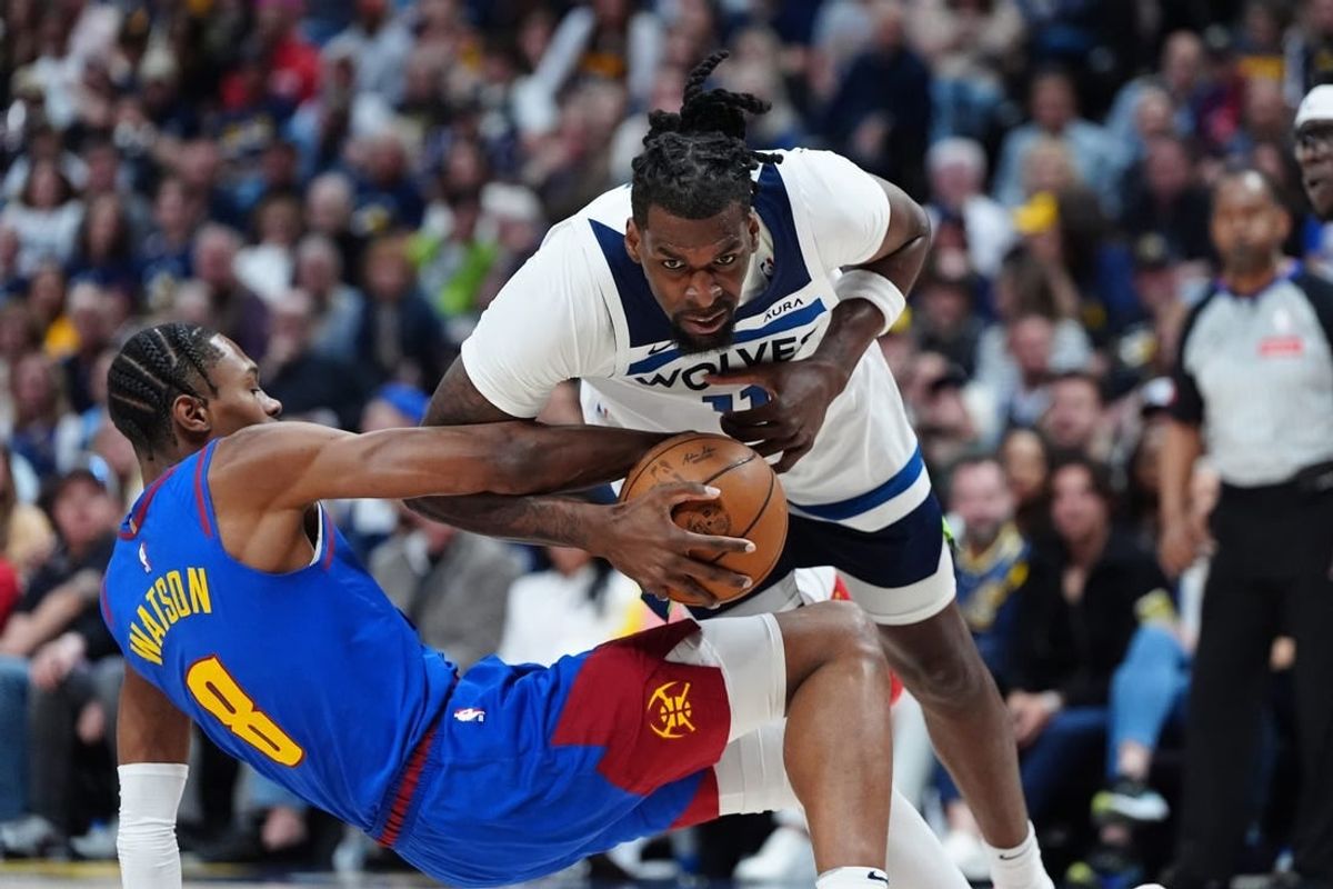 May 4, 2024; Denver, Colorado, USA; Minnesota Timberwolves center Naz Reid (11) collides into Denver Nuggets forward Peyton Watson (8) in the second quarter during game one of the second round for the 2024 NBA playoffs at Ball Arena.