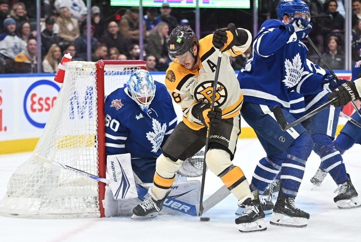 Dec 2, 2023; Toronto, Ontario, CAN; Toronto Maple Leafs goalie Joseph Woll (60) makes a save on a shot from Boston Bruins forward David Pastrnak (88) in the second period at Scotiabank Arena.