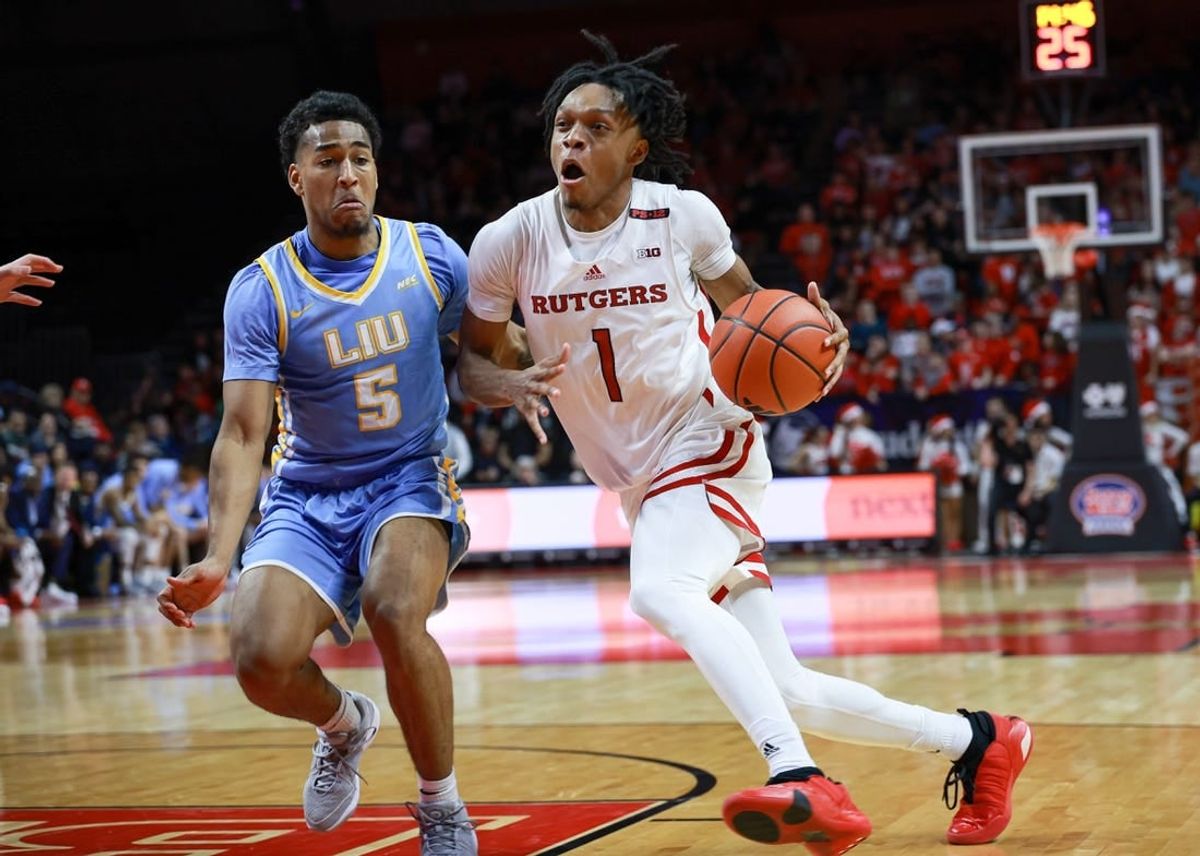Dec 16, 2023; Piscataway, New Jersey, USA; Rutgers Scarlet Knights guard Jamichael Davis (1) drives to the basket as Long Island Sharks guard Andre Washington (5) defends during the second half at Jersey Mike's Arena.