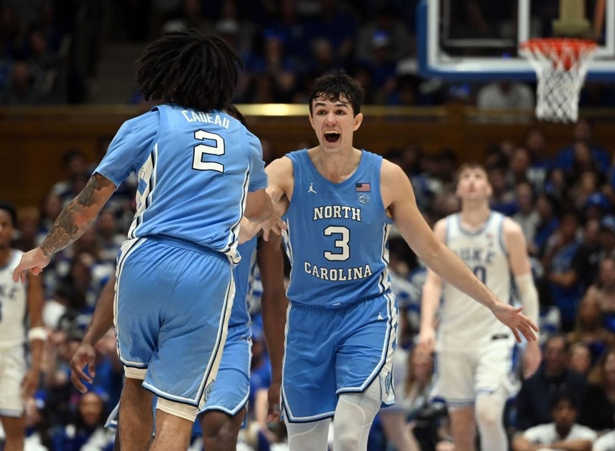 Mar 9, 2024; Durham, North Carolina, USA; North Carolina Tar Heels guard Cormac Ryan (3) reacts to a basket by  guard Elliot Cadeau (2) during the second half against the Duke Blue Devils at Cameron Indoor Stadium. The Tar Heels won 84-79.