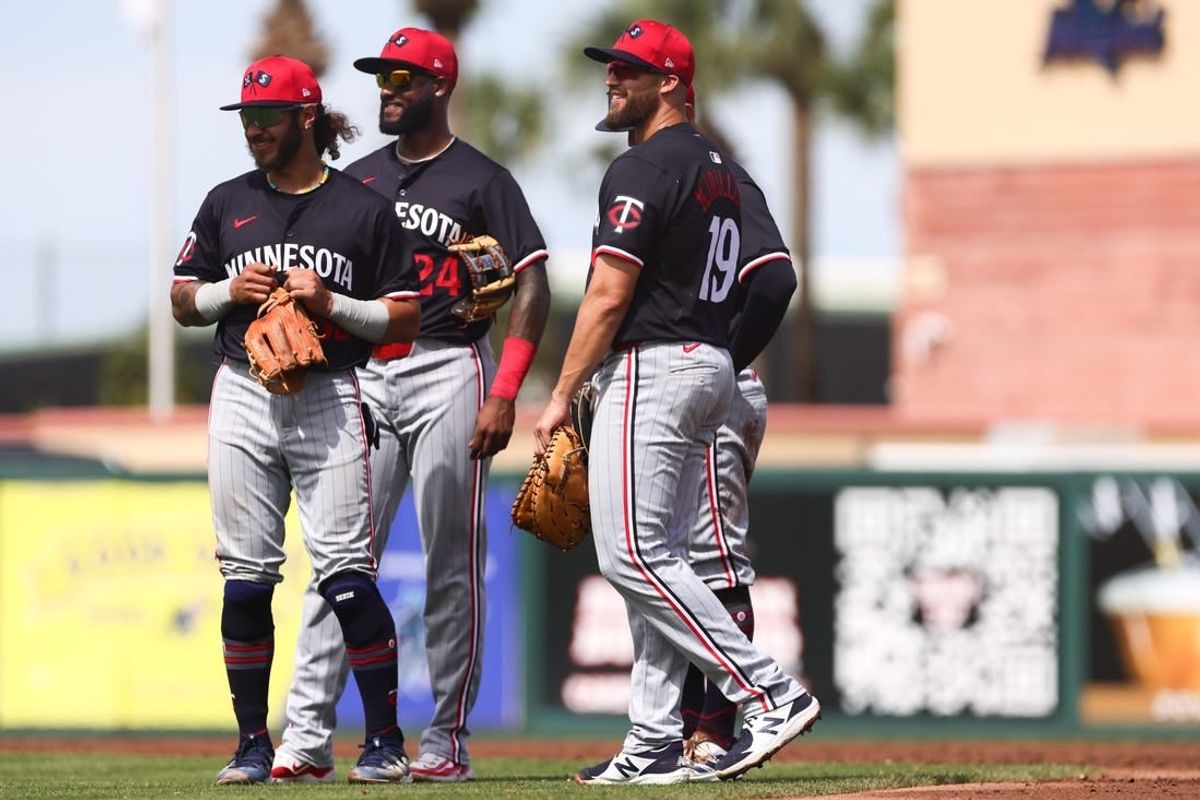 Mar 5, 2024; Jupiter, Florida, USA; Minnesota Twins second baseman Austin Martin (82), third baseman Niko Goodrum (24) and first baseman Alex Kirilloff (19) look on against the St. Louis Cardinals during the third inning at Roger Dean Chevrolet Stadium.