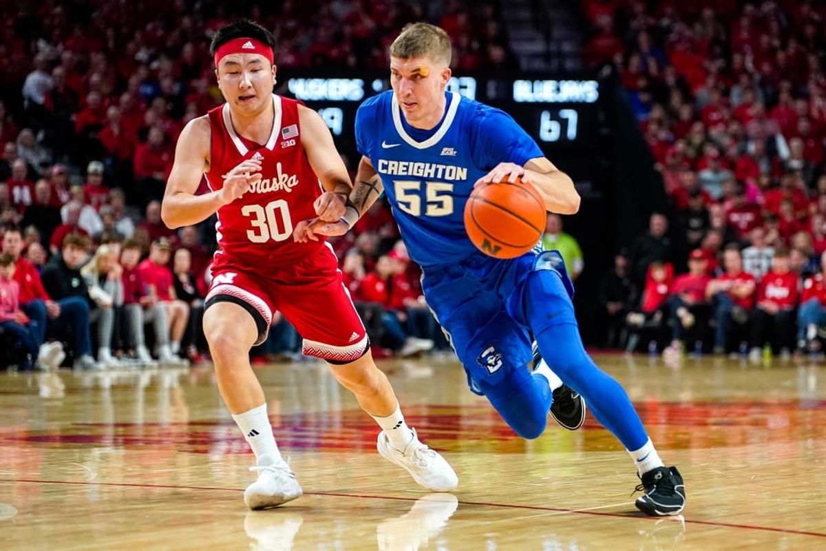 Dec 3, 2023; Lincoln, Nebraska, USA; Creighton Bluejays guard Baylor Scheierman (55) drives against Nebraska Cornhuskers guard Keisei Tominaga (30) during the second half at Pinnacle Bank Arena.