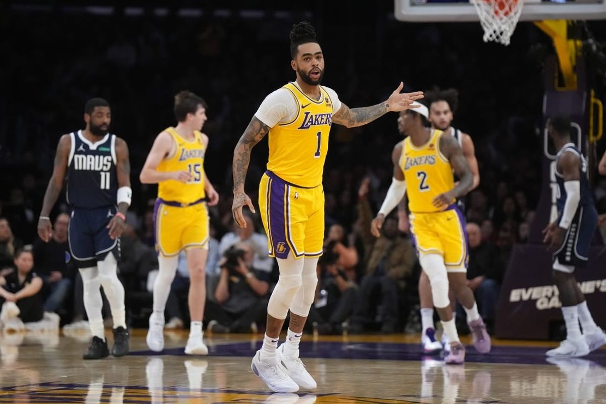 Jan 17, 2024; Los Angeles, California, USA; Los Angeles Lakers guard D'Angelo Russell (1) gestures after a three-point basket against the Dallas Mavericks in the first half at Crypto.com Arena.