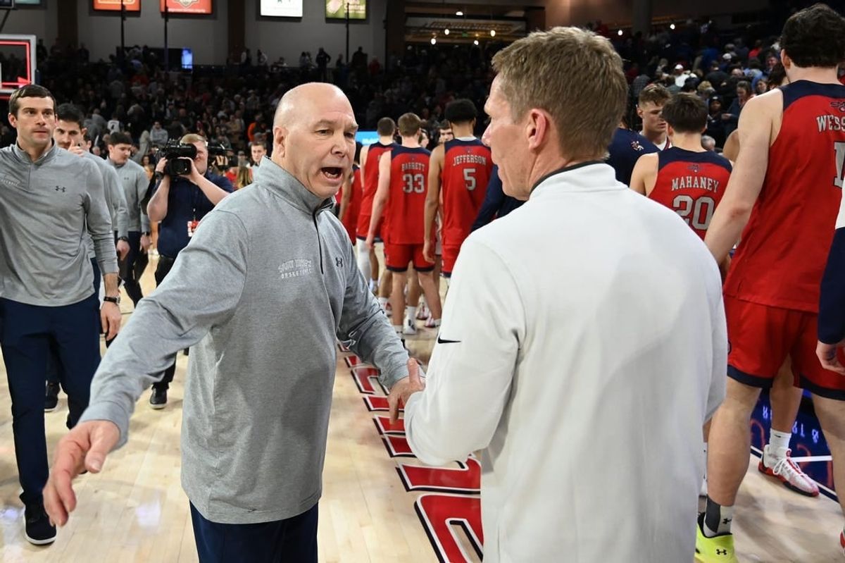 Feb 3, 2024; Spokane, Washington, USA; St. Mary's Gaels head coach Randy Bennett meets with Gonzaga Bulldogs head coach Mark Few after a game at McCarthey Athletic Center. St. Mary's Gaels won 64-62.