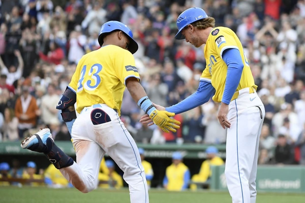 Apr 27, 2024; Boston, Massachusetts, USA;  Boston Red Sox short stop Ceddanne Rafaela (43) is congratulated by third base coach Kyle Hudson (84) after hitting a two run home run during the seventh inning against the Chicago Cubs at Fenway Park.
