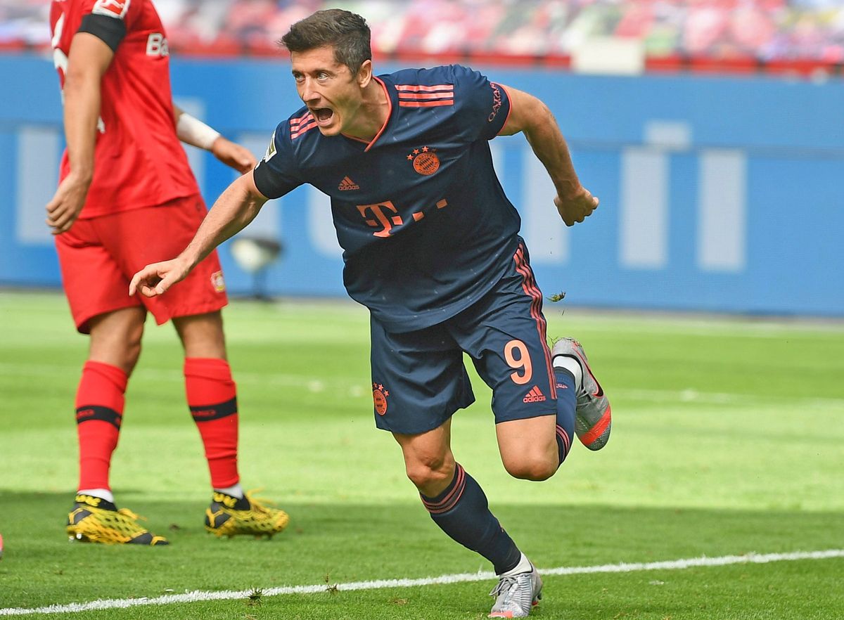 Robert Lewandowski scores one of his 30 goals for Bayern Munich this season.