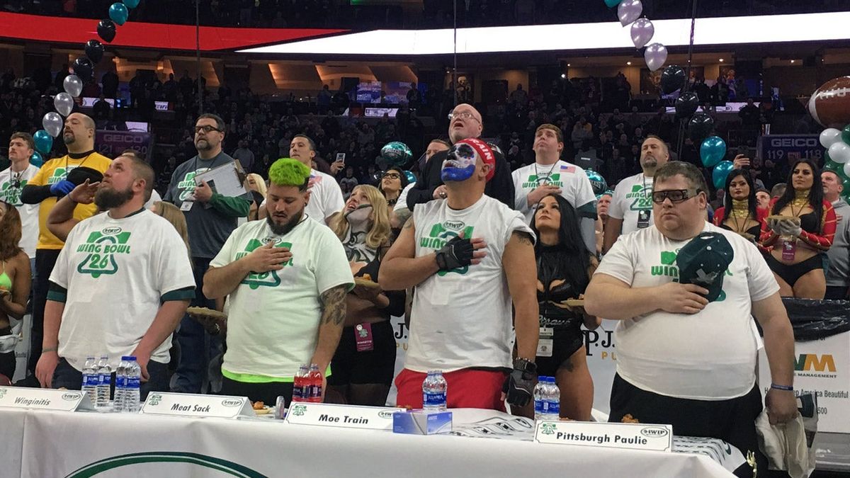Wing Bowl competitors stand for the national anthem. Apparently Colin Kaeperwing didn’t qualify. (Photo: Dan McQuade/Deadspin)