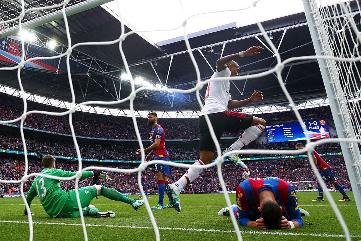 Ashley Young of Manchester United celebrates as goalkeeper Wayne Hennessey (13) and Joel Ward of Crystal Palace (right) look dejected after Man U’s first goal. Via  [object Object] .