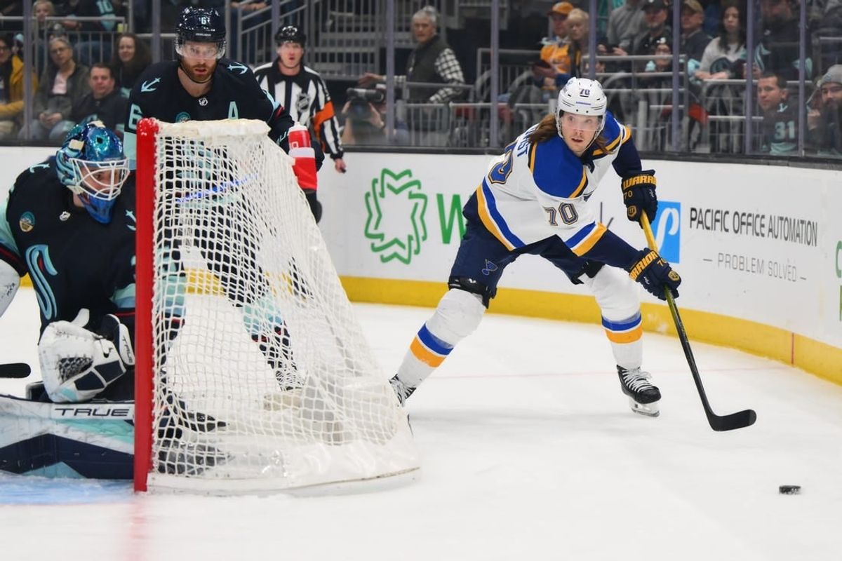 Jan 26, 2024; Seattle, Washington, USA; St. Louis Blues center Oskar Sundqvist (70) plays the puck behind the goal against the Seattle Kraken during the first period at Climate Pledge Arena.