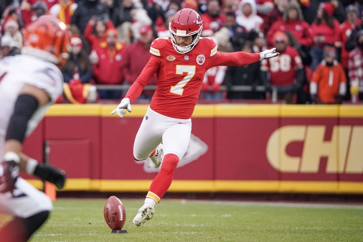 Dec 31, 2023; Kansas City, Missouri, USA; Kansas City Chiefs place kicker Harrison Butker (7) kicks the opening kickoff against the Cincinnati Bengals during the game at GEHA Field at Arrowhead Stadium.