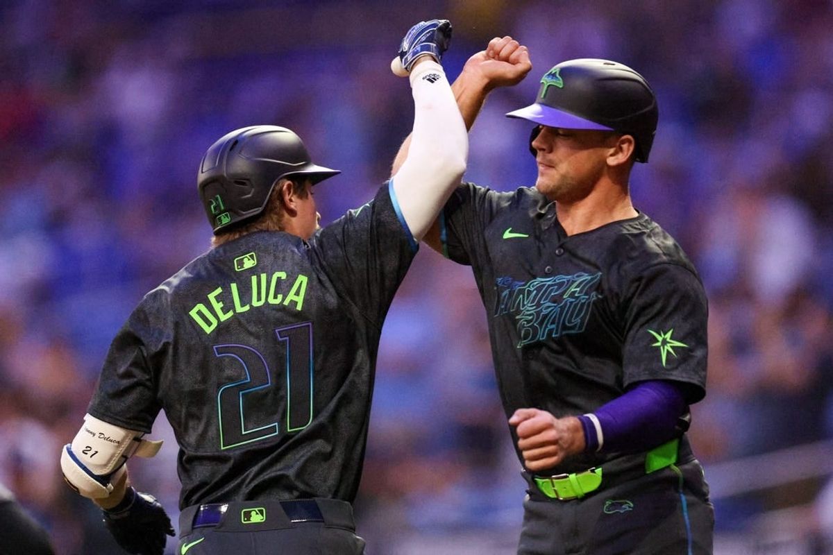 May 6, 2024; St. Petersburg, Florida, USA;  Tampa Bay Rays catcher Ben Rortvedt (30) congratulates outfielder Jonny DeLuca (21) after hitting a two run home run against the Chicago White Sox in the fifth inning at Tropicana Field.