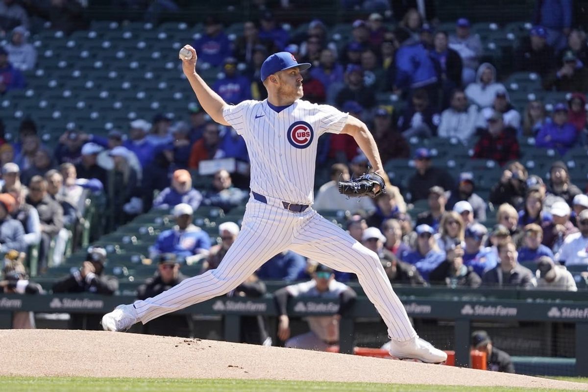 Apr 19, 2024; Chicago, Illinois, USA; Chicago Cubs starting pitcher Jameson Taillon pitches against the Miami Marlins during the first inning at Wrigley Field.