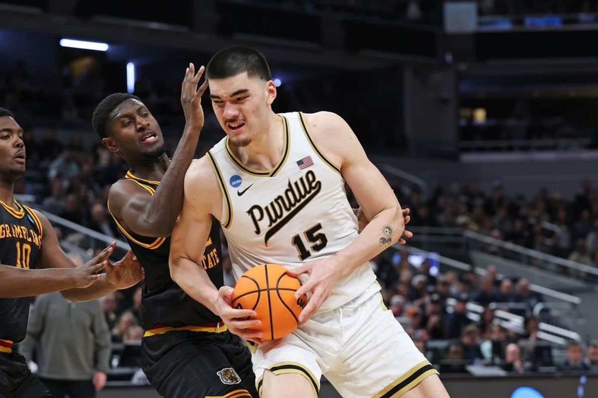 Mar 22, 2024; Indianapolis, IN, USA; Purdue Boilermakers center Zach Edey (15) makes a basket as Grambling State Tigers forward Malik Lamin (32) defends during the second half in the first round of the 2024 NCAA Tournament at Gainbridge FieldHouse.