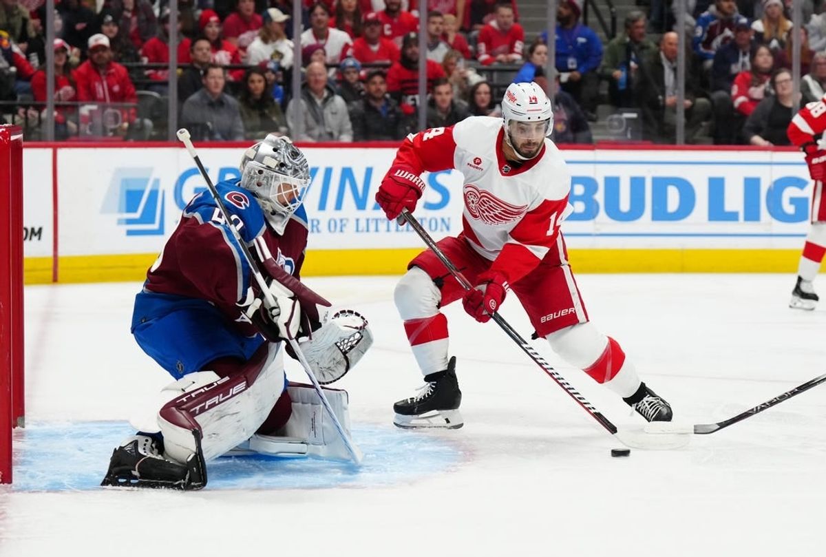 Mar 6, 2024; Denver, Colorado, USA; Detroit Red Wings center Robby Fabbri (14) shoots and scores on Colorado Avalanche goaltender Alexandar Georgiev (40) in the first period at Ball Arena.