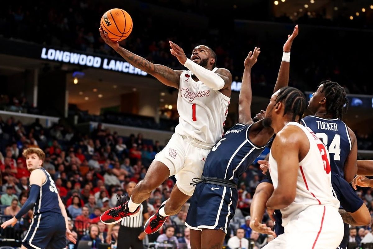 Mar 22, 2024; Memphis, TN, USA;  Houston Cougars guard Jamal Shead (1) shoots the ball against Longwood Lancers guard Johnathan Massie (5) during the first half in the first round of the 2024 NCAA Tournament at FedExForum.