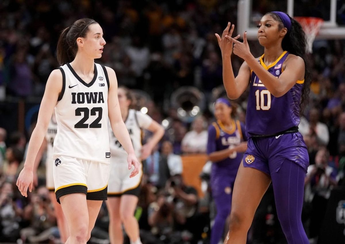 In one of the iconic moments of last year's NCAA women's tournament, Angel Reese of LSU points to her ring finger as Iowa's Caitlin Clark can only watch during the national championship game. LSU defeated Iowa 102   85.