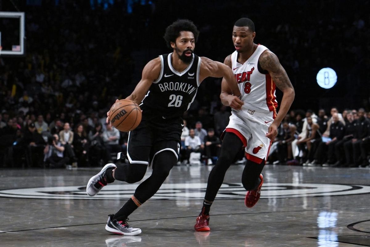 Nov 25, 2023; Brooklyn, New York, USA; Brooklyn Nets guard Spencer Dinwiddie (26) drives against Miami Heat forward Jamal Cain (8) during the fourth quarter at Barclays Center.