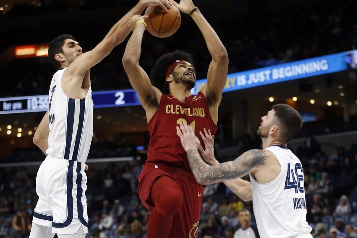Feb 1, 2024; Memphis, Tennessee, USA; Memphis Grizzlies forward-center Santi Aldama (7) blocks the shot of Cleveland Cavaliers center Jarrett Allen (31) during the first half at FedExForum.