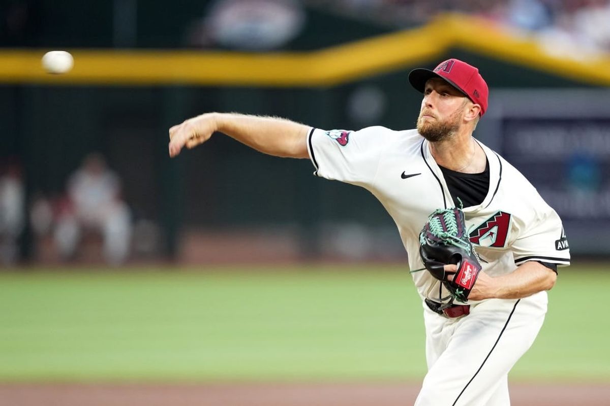 Apr 15, 2024; Phoenix, Arizona, USA; Arizona Diamondbacks pitcher Merrill Kelly pitches against the Chicago Cubs during the first inning at Chase Field. All players wore  number 42 to commemorate Jackie Robinson Day.