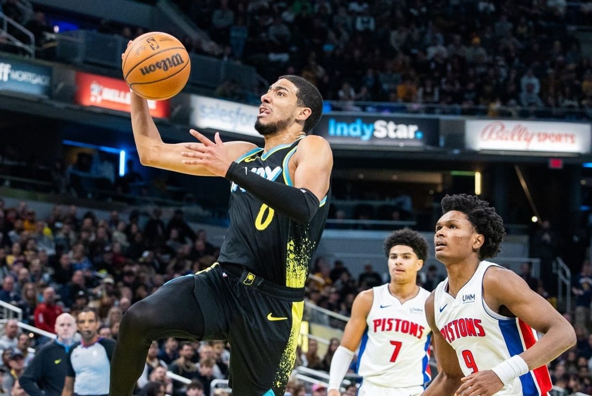 Nov 24, 2023; Indianapolis, Indiana, USA; Indiana Pacers guard Tyrese Haliburton (0) shoots the ball while Detroit Pistons forward Ausar Thompson (9) defends in the second half at Gainbridge Fieldhouse.