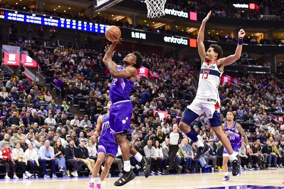 Mar 4, 2024; Salt Lake City, Utah, USA; Utah Jazz guard Collin Sexton (2) takes a shot around Washington Wizards guard Jordan Poole (13) during the second half at the Delta Center.