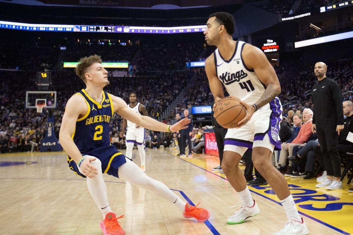 Jan 25, 2024; San Francisco, California, USA; Sacramento Kings forward Trey Lyles (41) looks to pass over Golden State Warriors guard Brandin Podziemski (2) during the first quarter at Chase Center.