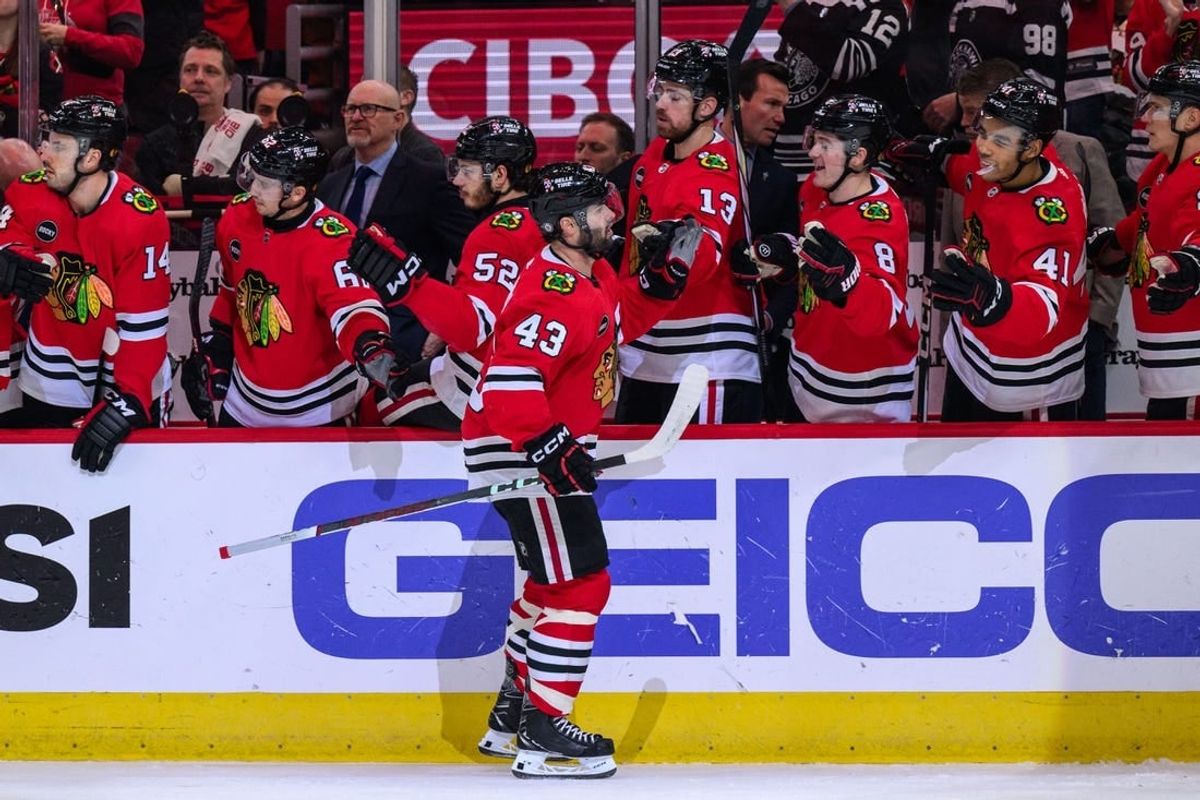 Jan 7, 2024; Chicago, Illinois, USA; Chicago Blackhawks center Colin Blackwell (43) celebrates his goal with teammates against the Calgary Flames during the first period at the United Center.