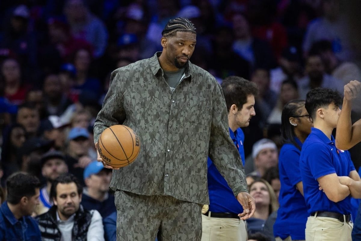 Mar 27, 2024; Philadelphia, Pennsylvania, USA; Injured Philadelphia 76ers center Joel Embiid dribbles the ball during a timeout in the second quarter against the LA Clippers at Wells Fargo Center.