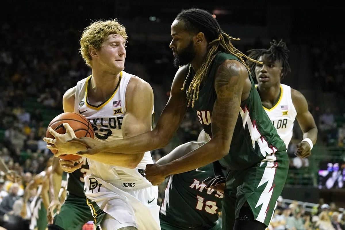 Dec 22, 2023; Waco, Texas, USA; Baylor Bears forward Caleb Lohner (33) grabs the ball from Mississippi Valley State Delta Devils guard Arecko Gipson (23) at Ferrell Center.