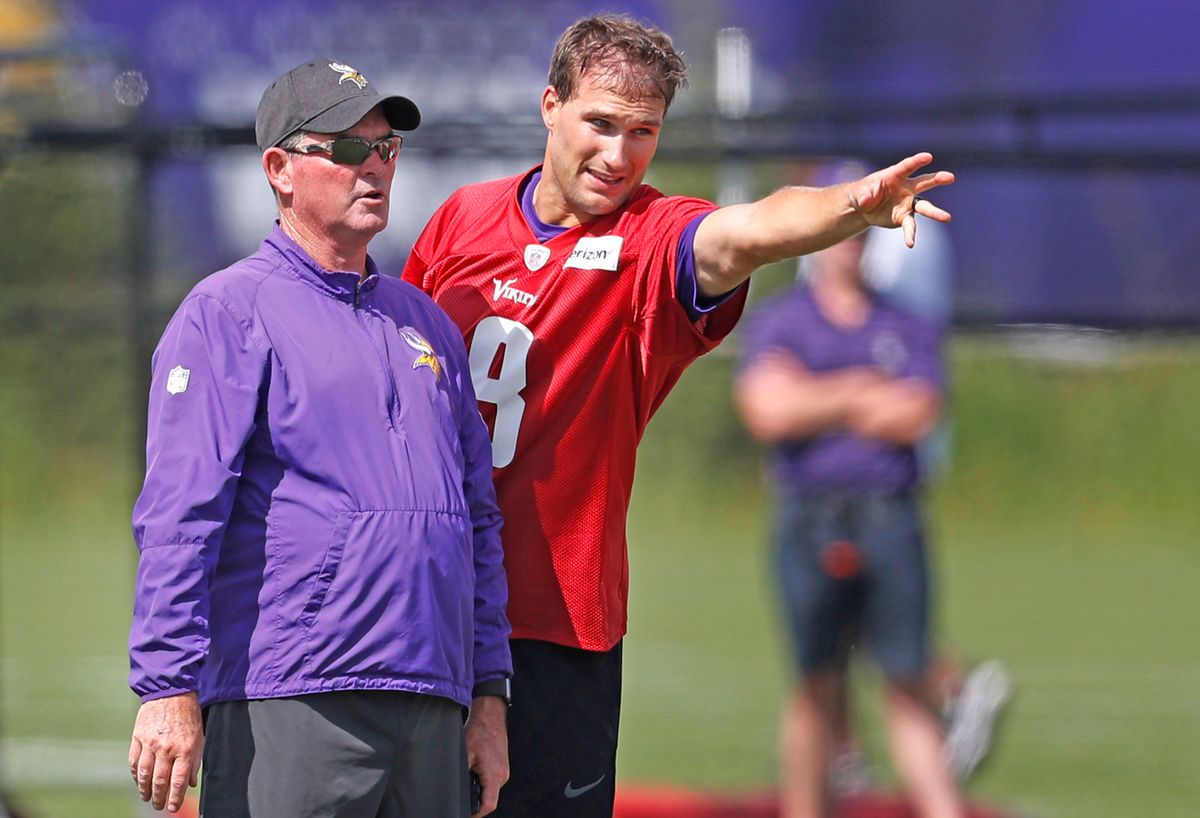 Kirk Cousins gestures toward mediocrity    as Mike Zimmer looks on .
