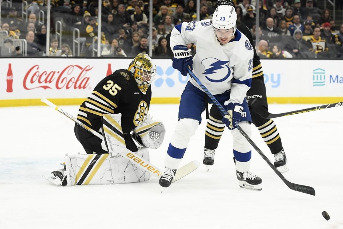 Feb 13, 2024; Boston, Massachusetts, USA; Tampa Bay Lightning center Michael Eyssimont (23) looks for the loose puck in front of Boston Bruins goaltender Linus Ullmark (35) during the second period at TD Garden.