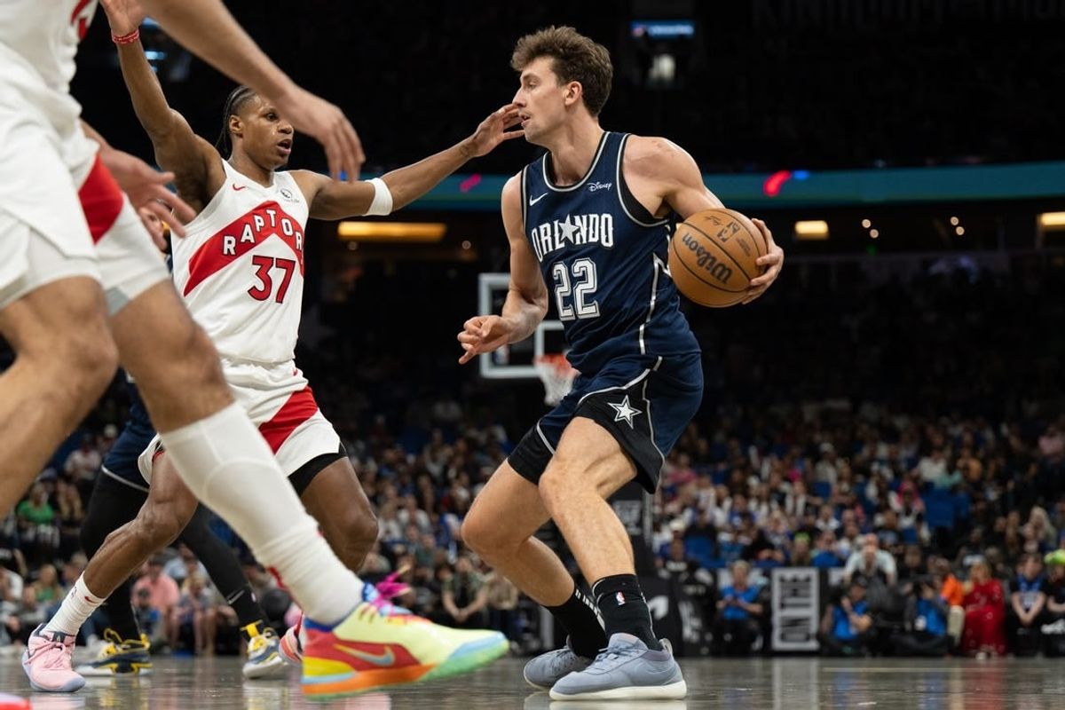 Mar 17, 2024; Orlando, Florida, USA; Orlando Magic forward Franz Wagner (22) dribbles the ball against Toronto Raptors guard Jamie'us Ramsey (37) in the second quarter at KIA Center.