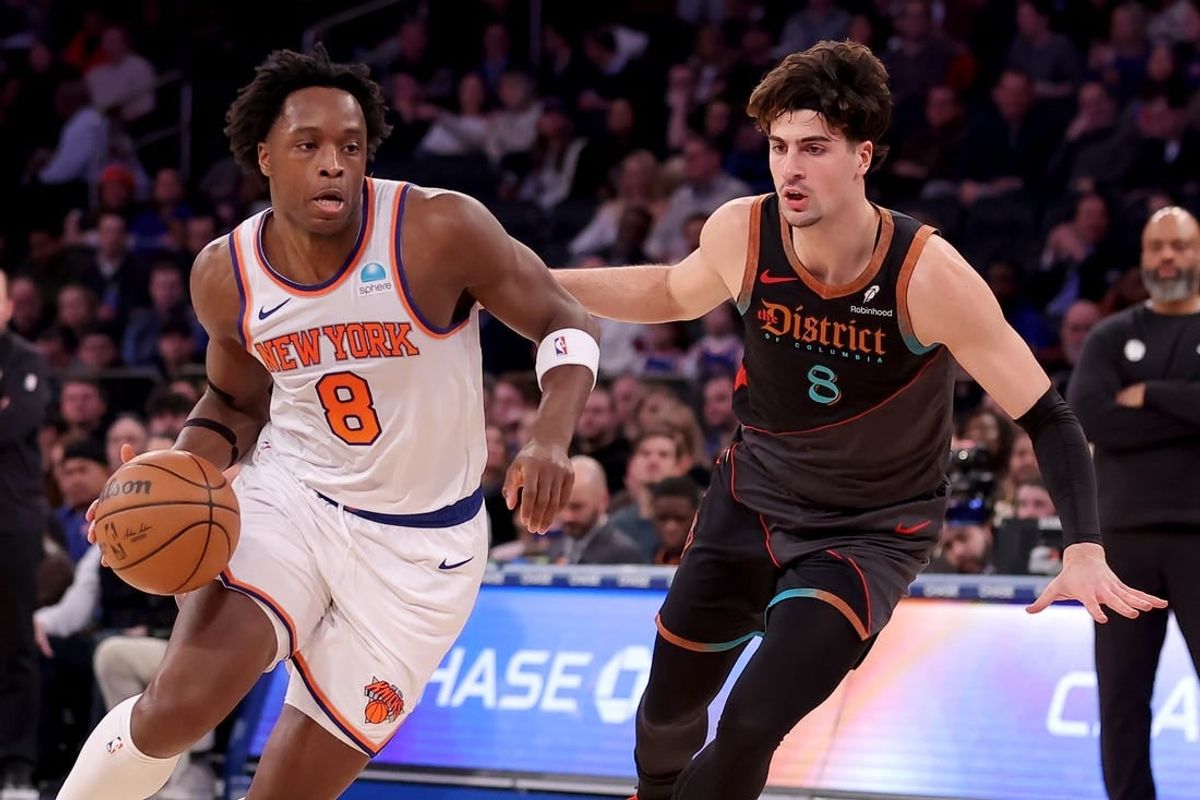 Jan 18, 2024; New York, New York, USA; New York Knicks forward OG Anunoby (8) drives to the basket against Washington Wizards forward Deni Avdija (8) during the second quarter at Madison Square Garden.