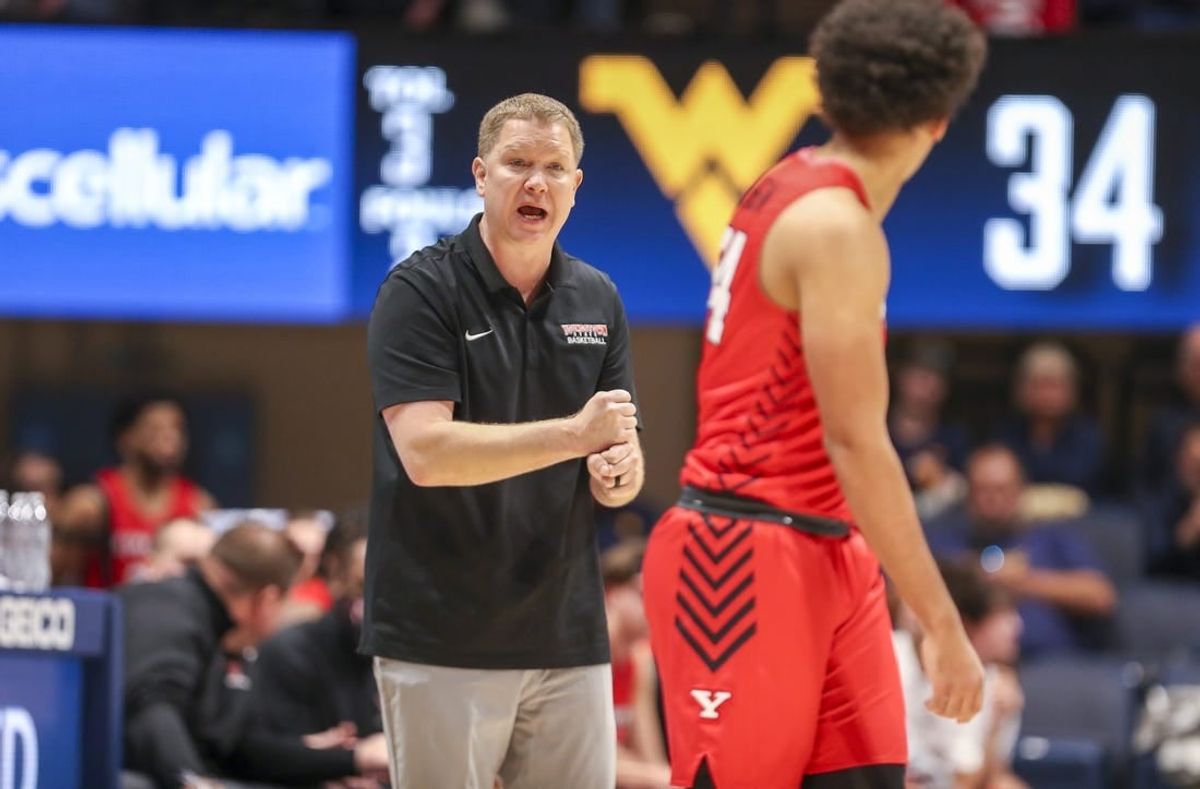 Dec 22, 2021; Morgantown, West Virginia, USA; Youngstown State Penguins head coach Jerrod Calhoun calls out a play during the second half against the West Virginia Mountaineers at WVU Coliseum.