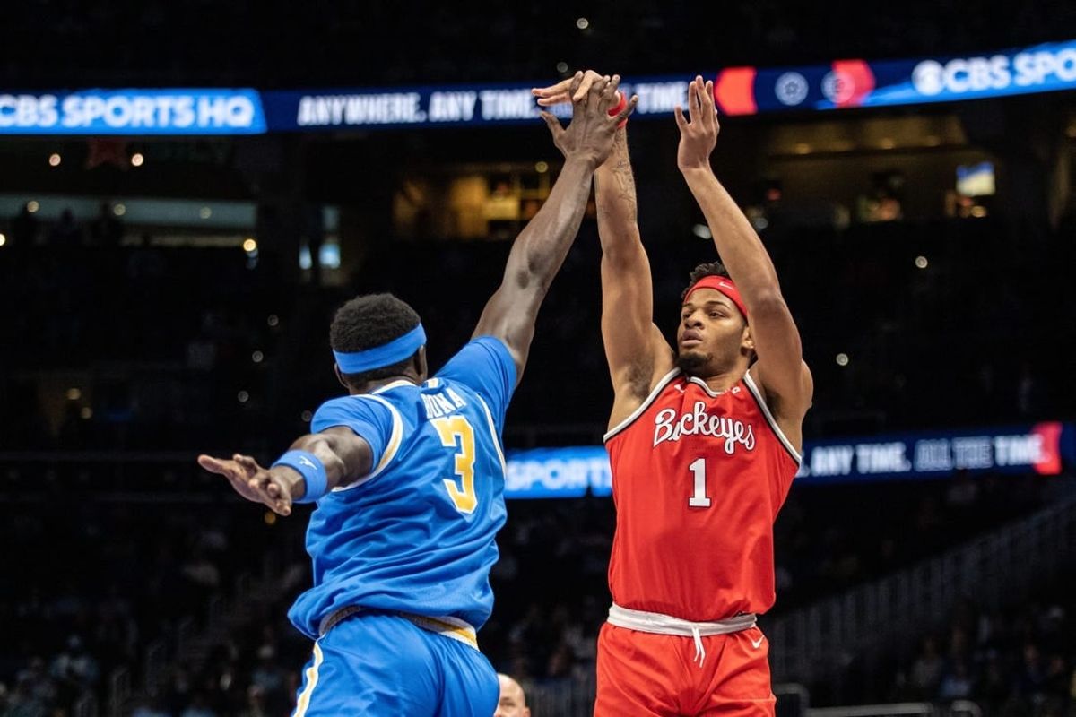 Dec 16, 2023; Atlanta, GA, USA; Ohio State Buckeyes guard Roddy Gayle Jr. (1) shoots over UCLA Bruins forward Adem Bona (3) during the first half at State Farm Arena.