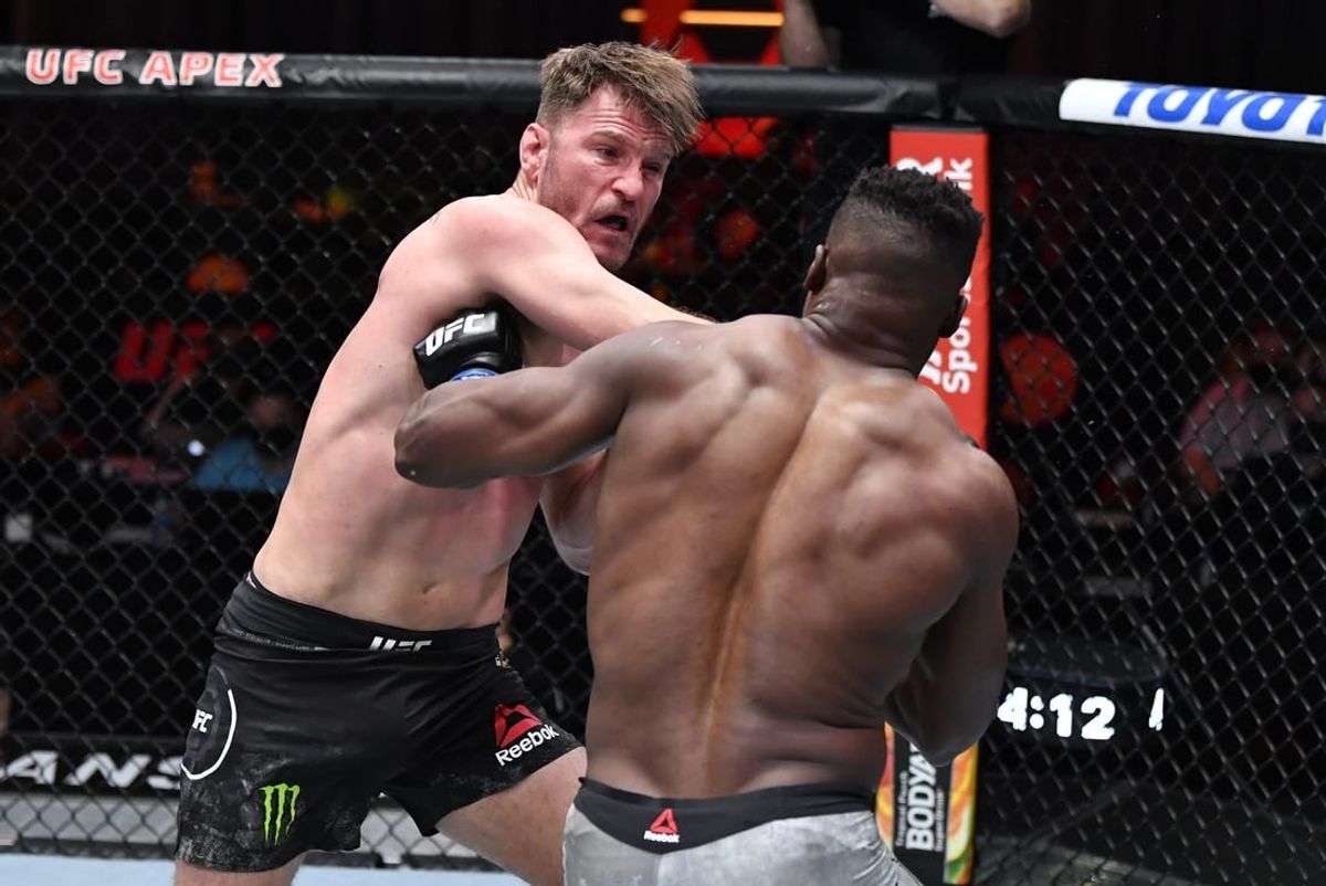 Mar 27, 2021; Las Vegas, NV, USA;  Stipe Miocic punches Francis Ngannou of Cameroon in their UFC heavyweight championship fight during the UFC 260 event at UFC APEX on March 27, 2021 in Las Vegas, Nevada.