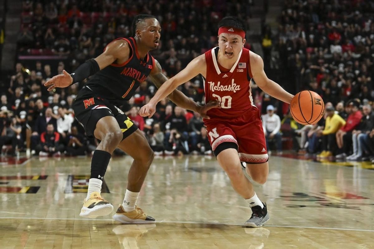 Jan 27, 2024; College Park, Maryland, USA;  Nebraska Cornhuskers guard Keisei Tominaga (30) drives to the basket on Maryland Terrapins guard Jahmir Young (1) during the first half at Xfinity Center.