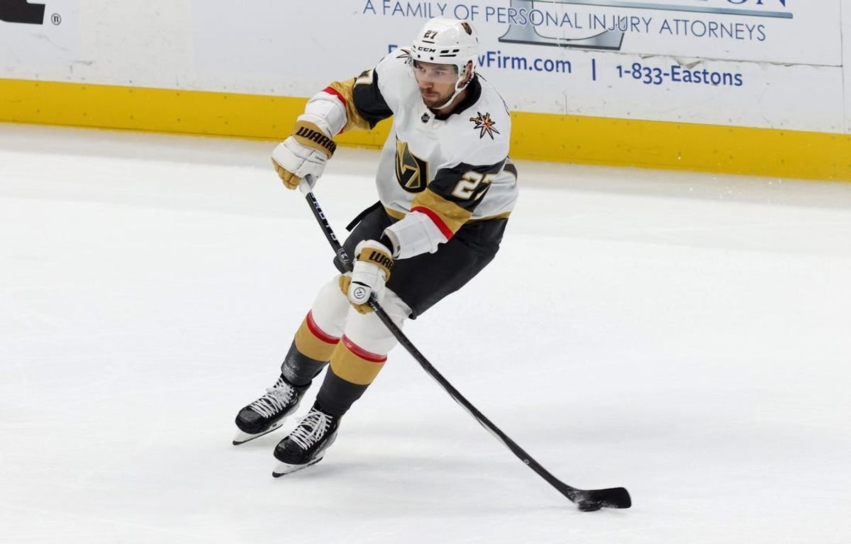 Nov 5, 2023; Anaheim, California, USA; Vegas Golden Knights defenseman Shea Theodore (27) passes during the third period against the Anaheim Ducks at Honda Center.