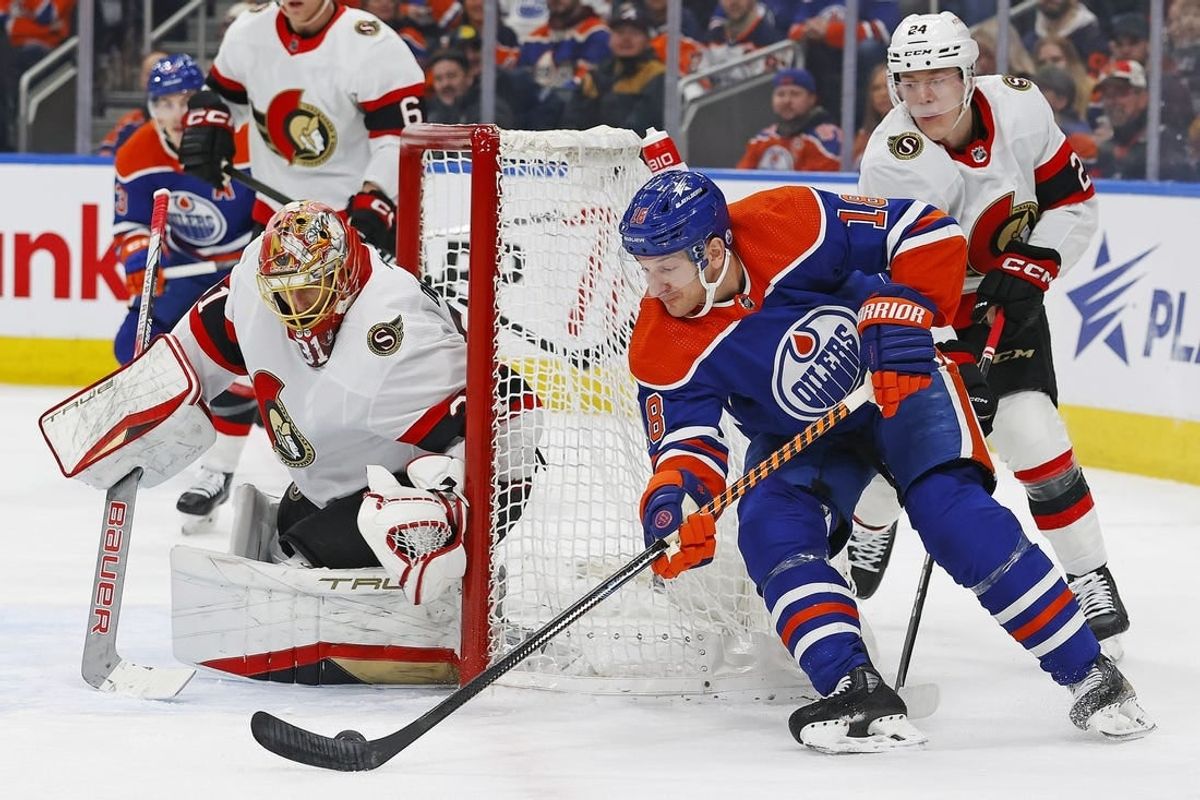 Jan 6, 2024; Edmonton, Alberta, CAN; Edmonton Oilers forward Zach Hyman (18) controls the puck against Ottawa Senators goaltender Anton Forsberg (31) during the first period at Rogers Place.