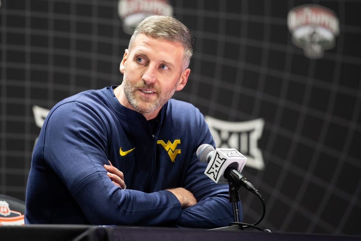 Oct 18, Kansas City, MO, USA; West Virginia interim head coach Josh Eilert answers questions at Big 12 Men s Basketball Tipoff at T-Mobile Center.