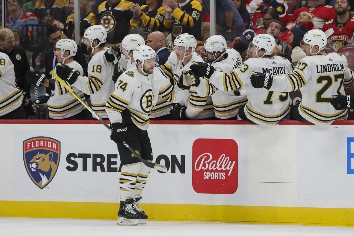 Nov 22, 2023; Sunrise, Florida, USA; Boston Bruins left wing Jake DeBrusk (74) celebrates with teammates after scoring against the Florida Panthers during the second period at Amerant Bank Arena.