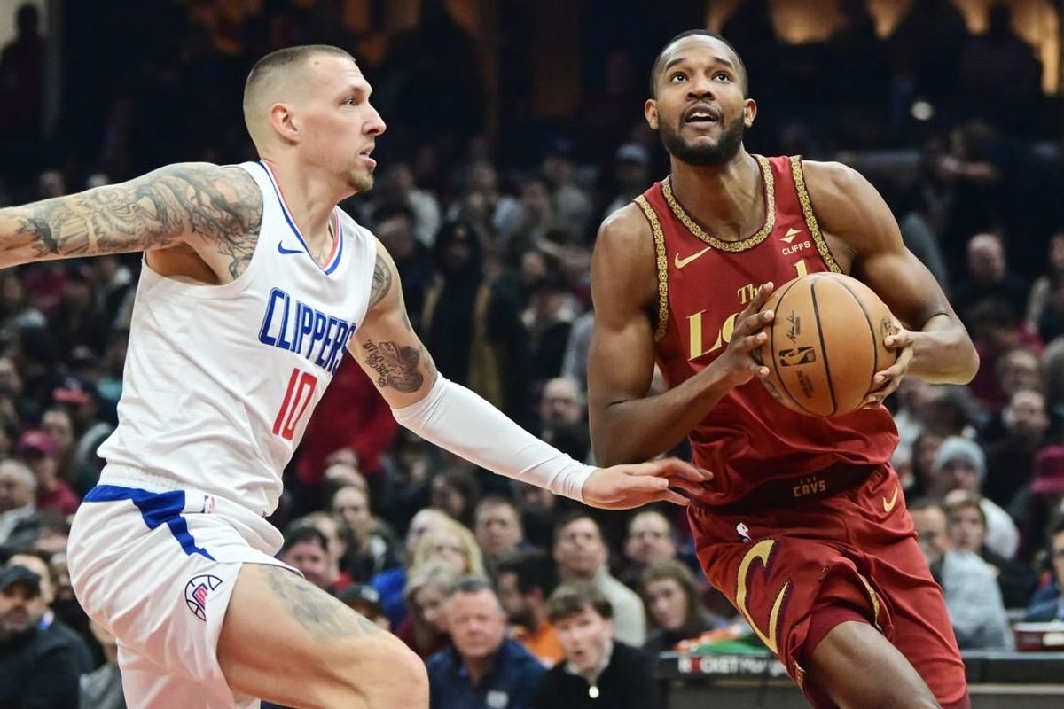 Jan 29, 2024; Cleveland, Ohio, USA; Cleveland Cavaliers forward Evan Mobley (4) drives to the basket against Los Angeles Clippers center Daniel Theis (10) during the first half at Rocket Mortgage FieldHouse.