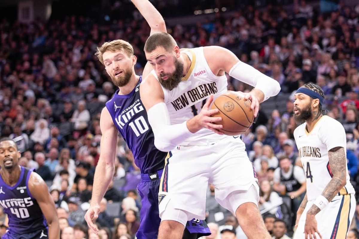 Jan 7, 2024; Sacramento, California, USA; New Orleans Pelicans center Jonas Valanciunas (17) grabs a rebound against Sacramento Kings forward Domantas Sabonis (10) during the second quarter at Golden 1 Center.