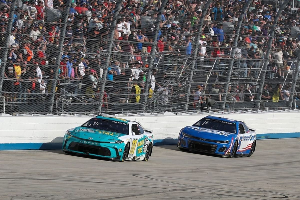 Apr 28, 2024; Dover, Delaware, USA; NASCAR Cup Series driver Denny Hamlin (11) leads driver Kyle Larson (5) late in the Wurth 400 at Dover Motor Speedway.