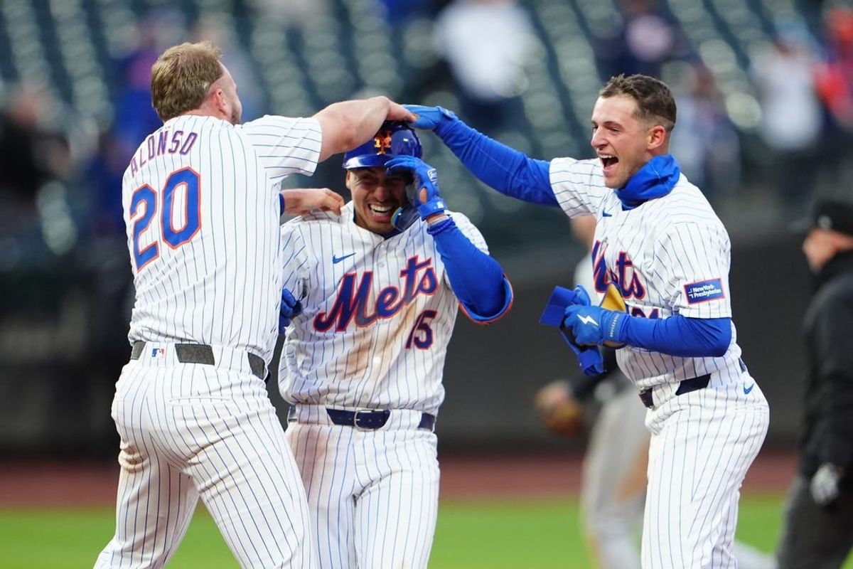 Apr 4, 2024; New York City, New York, USA; New York Mets first baseman Pete Alonso (20) and third baseman Zack Short (21) congratulate left fielder Tyrone Taylor (15) for the winning hit against the Detroit Tigers during the ninth inning at Citi Field.