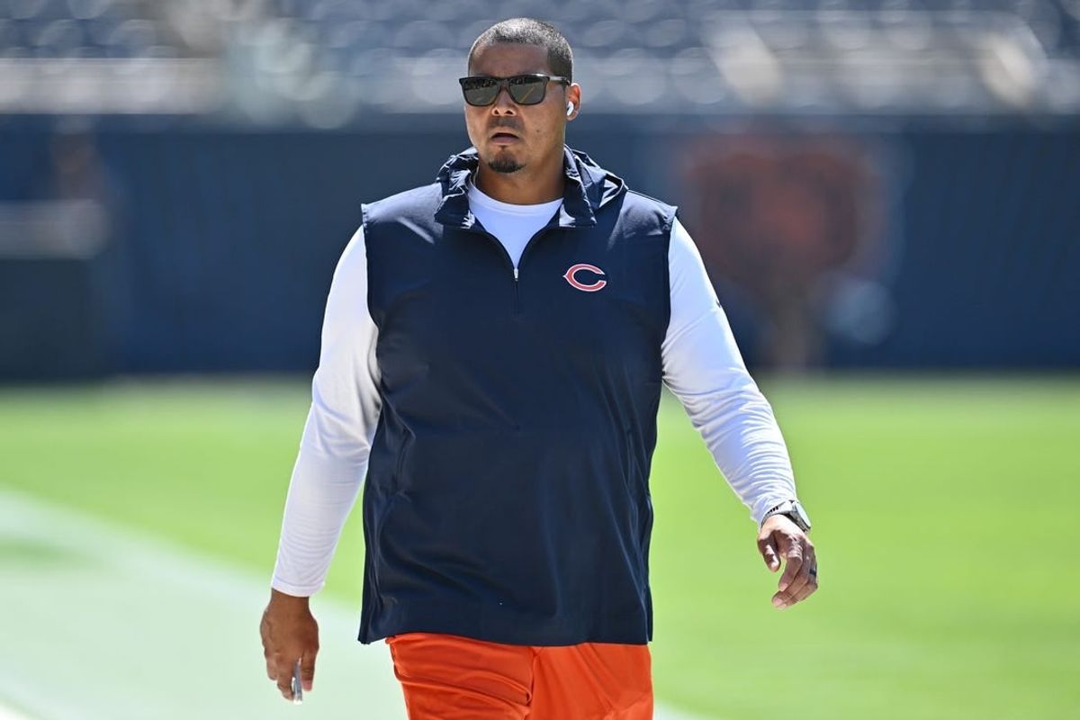 Chicago Bears general manager Ryan Poles walks laps around the field before their game against the Green Bay Packers at Soldier Field.